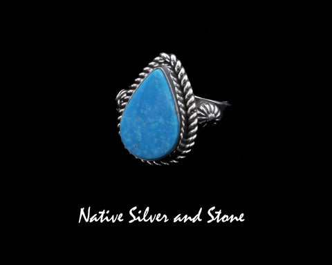 Z Artie Yellowhorse - Navajo<br>RGTTST<br>3/4" Ring<br>Blue Gem Turquoise<br>Reverse Teardrop<br>Raised Stamped Shots on Flanks<br>Single Twist<br>Sterling Silver<br>Sizes: 6-1/4