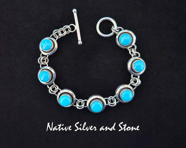 Artie Yellowhorse - Navajo<br>Bracelet - Link <br>1/2" Shadowbox Rounds with<br>8mm Sleeping Beauty Turquoise<br>Sterling Silver<br>Size (as worn)  6-1/8 to 6-3/4