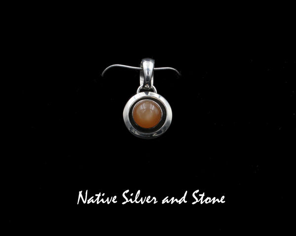 Artie Yellowhorse - Navajo<br>5/8" Pendant<br>8mm Apricot Moonstone<br>Small Domed Shadowbox<br>Sterling Silver