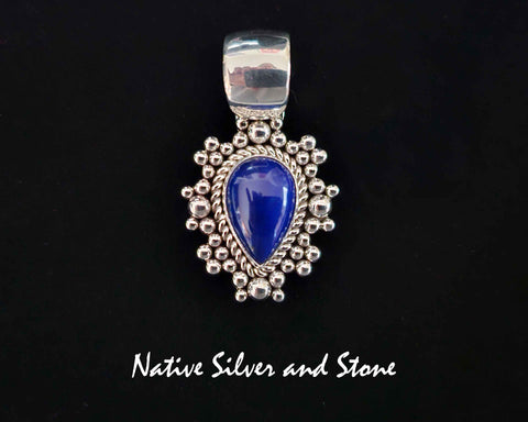 Artie Yellowhorse - Navajo<br>PDTLTBB<br>1-3/16"  Pendant<br>Lapis Lazuli<br>Small Vertical Reverse Teardrop<br>Single Twist - Burst Beads/Scatterdot<br>Sterling Silver