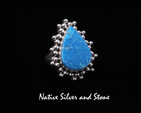 Artie Yellowhorse - Navajo<br>RGTMPBB<br>1-1/4" Ring<br>Mineral Park Turquoise<br>Reverse Teardrop<br>Narrow Split Band<br>Burst Beads/Scatterdot<br>Sterling Silver<br>Size: 7-1/2