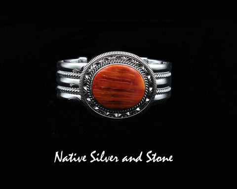 Z Artie Yellowhorse, Navajo<br>Henry Chackee, Navajo (Deceased)<br>BCOSTDSCP<br>7/8" Bracelet Cuff<br>27mm x 23mm Orange Spiny Oval<br>Twist, Pinches,<br>& Coin-Edge Straight Sawcuts<br>Sterling Silver<br>Size 6-7/16 (Medium