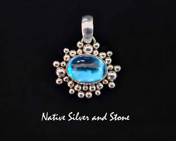 Artie Yellowhorse - Navajo<br>PDTTZTBB<br>13/16"  Pendant<br>Topaz<br>Small Horizontal Oval<br>Single Twist - Burst Beads/Scatterdot<br>Sterling Silver