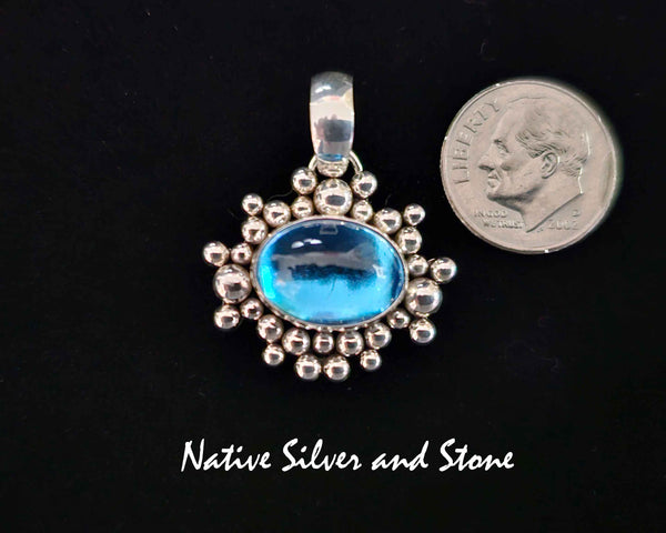 Artie Yellowhorse - Navajo<br>PDTTZTBB<br>13/16"  Pendant<br>Topaz<br>Small Horizontal Oval<br>Single Twist - Burst Beads/Scatterdot<br>Sterling Silver