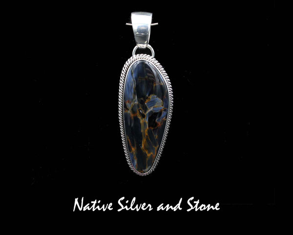 Z Artie Yellowhorse - Navajo<br>2" Pendant<br>Pietersite/Pietercite - Blue/Gold<br> Medium Vertical Freeform<br>Double Twist<br>Sterling Silver