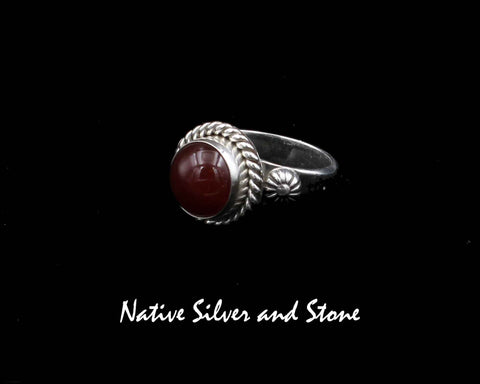 Z Artie Yellowhorse - Navajo<br>9/16" Ring<br>9+mm Carnelian Round<br>Single Twist<br>Shots on Flanks<br>Sterling Silver<br>Size: 7