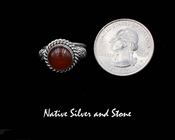 Artie Yellowhorse - Navajo<br>1/2" Ring<br>7+mm Carnelian Round<br>Single Twist<br>Shots on Flanks<br>Sterling Silver<br>Size: 8