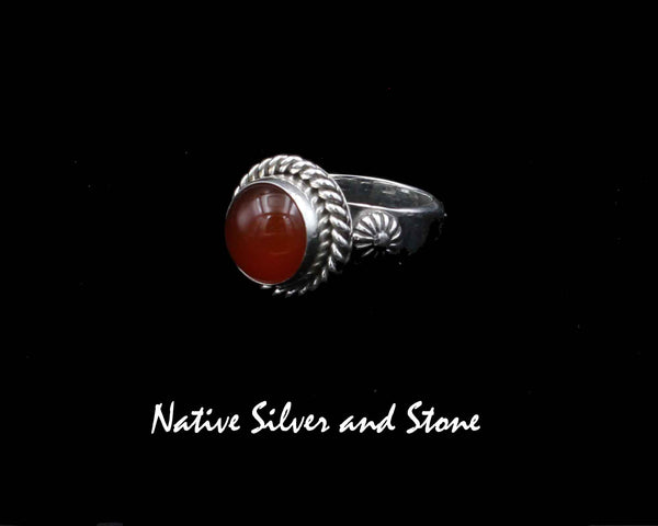 Artie Yellowhorse - Navajo<br>1/2" Ring<br>7+mm Carnelian Round<br>Single Twist<br>Shots on Flanks<br>Sterling Silver<br>Size: 8