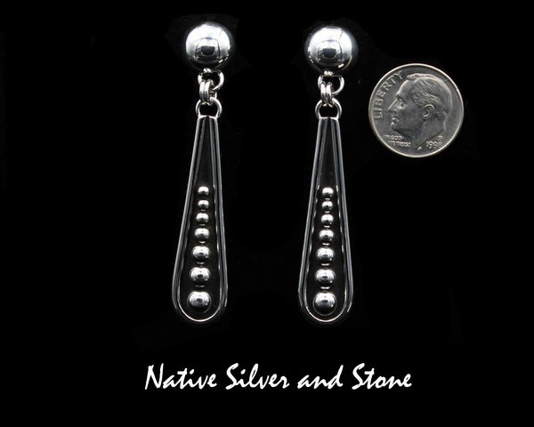 Artie Yellowhorse -  Navajo<br>2-1/4" Earrings<br>Elongated Teardrop "Bat"<br>7 Graduated Bead/Dot Accents<br>9mm Dome<br>Dangle Post<br>Sterling Silver