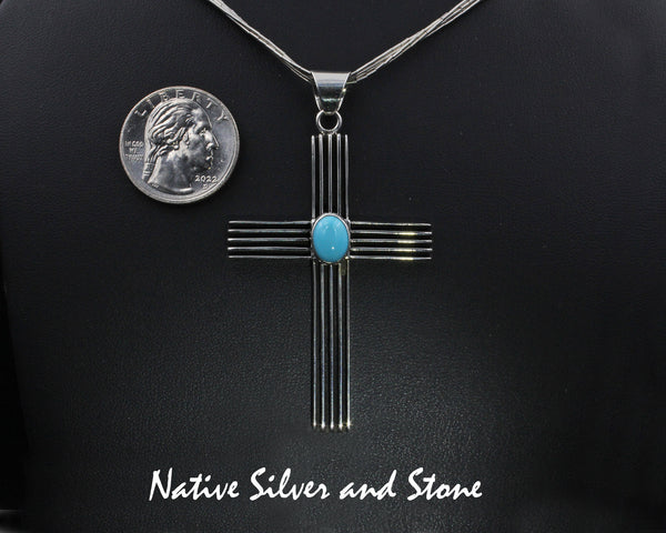 Frances Jones - Navajo<br>2-5/16" Pendant - Large<br>Cross with Channel Tracks<br>Sleeping Beauty Turquoise Oval Accent<br>Sterling Silver