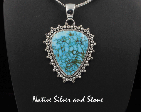 Z Artie Yellowhorse* - Navajo<br>2-1/4"  Pendant<br>Turquoise Mountain - Turquoise<br>Medium-Large Vertical Triangle<br>Single Twist - Burst Beads<br>Sterling Silver