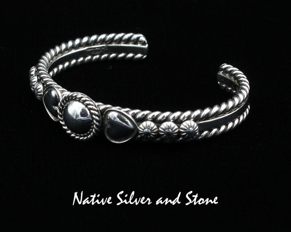 Artie Yellowhorse - Navajo<br>BCASHTST<br>3/8" Bracelet Cuff<br>9/16" Dome w Twist<br>Dual Hearts, & Shots<br>Sterling Silver<br>Size 6-1/8 (Medium)