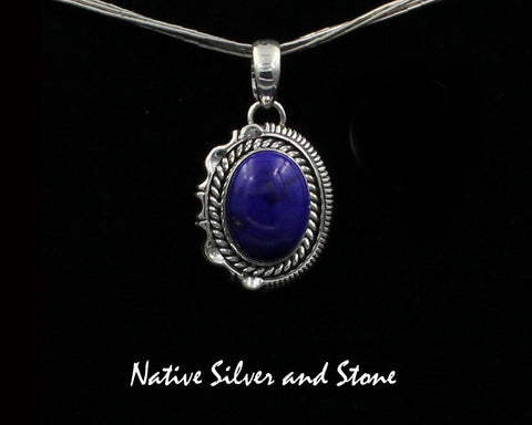 Z Artie Yellowhorse - Navajo<br>PDLTSC<br>1"H Pendant<br>16mm x 12mm Lapis Lazuli Vertical Oval<br>Twist & Single Straight Sawcut with Pinches<br>Sterling Silver