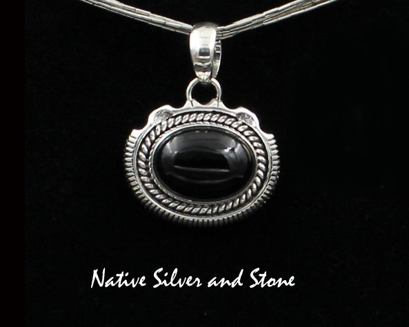 Z Artie Yellowhorse - Navajo<br>3/4"H Pendant<br>12mm x 16mm Onyx Horizontal Oval<br>Twist & Single Sawcut wPinch<br>Sterling Silver