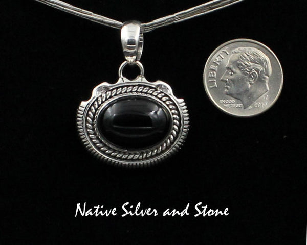 Z Artie Yellowhorse - Navajo<br>3/4"H Pendant<br>12mm x 16mm Onyx Horizontal Oval<br>Twist & Single Sawcut wPinch<br>Sterling Silver