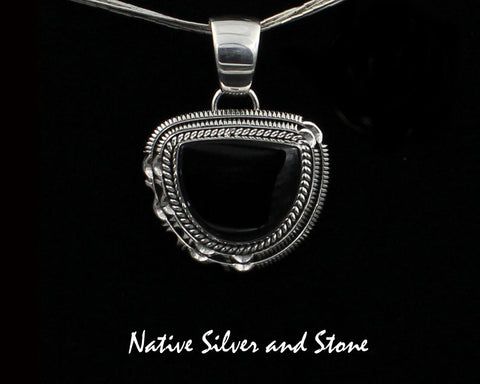 Z Artie Yellowhorse - Navajo<br>1-3/16"H Pendant<br>18mm x 22mm Onyx Vertical Half-Moon<br>Twist & Double Sawcut with Pinches<br>Sterling Silver