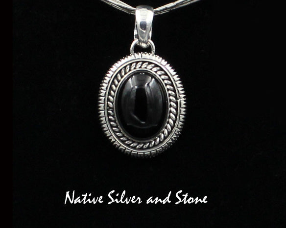 Artie Yellowhorse - Navajo<br>PDOTSSC<br>1"H Pendant<br>16mm x 12mm Onyx Vertical Oval<br>Single Twist & Straight Sawcut<br>Sterling Silver