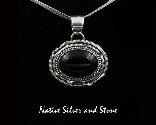 Artie Yellowhorse - Navajo<br>PDOXTDSCP<br>1-1/4" Pendant<br>Black Onyx<br>Horizontal Oval (Medium) <br>Single Twist & Double Sawcut w Pinches<br>Sterling Silver