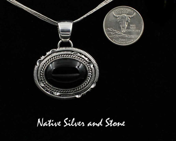 Artie Yellowhorse - Navajo<br>PDOXTDSCP<br>1-1/4" Pendant<br>Black Onyx<br>Horizontal Oval (Medium) <br>Single Twist & Double Sawcut w Pinches<br>Sterling Silver
