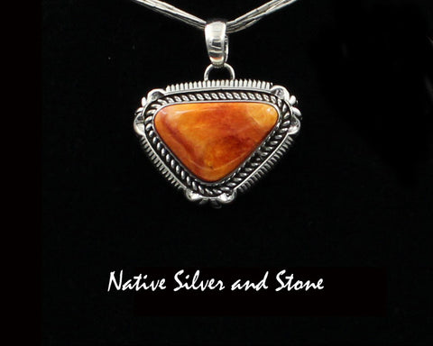 Artie Yellowhorse - Navajo<br>POSTSCP<br>15/16"  Pendant<br>15mm x 22mm Orange Spiny<br>Small Horizontal Triangle<br>Single Twist & Sawcut w Pinches<br>Sterling Silver