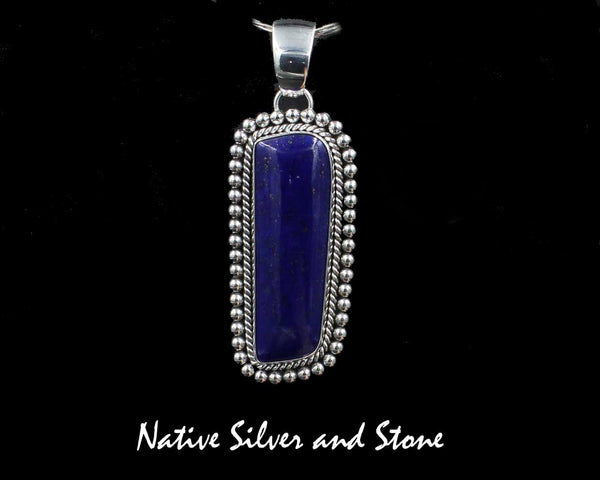Z Artie Yellowhorse<br>Navajo<br>2-1/2" Pendant <br>50mm x 17mm Lapis Lazuli<br>Freeform Rectangle<br>Single Twist & Bead<br>Sterling Silver