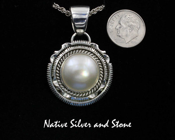 Z Artie Yellowhorse - Navajo<br>PDPTDSCP<br>1-1/8"  Pendant<br>16mm White Mabe Pearl<br>Single Twist & Double Sawcut w Pinches<br>Sterling Silver