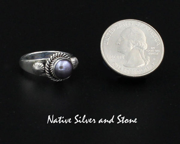 Z Artie Yellowhorse - Navajo<br>9/16" Ring<br>7+mm Round Med Dark Grey Pearl<br>Single Twist Perimeter<br>Shots on Flanks<br>Sterling Silver Sizes: Out of Stock