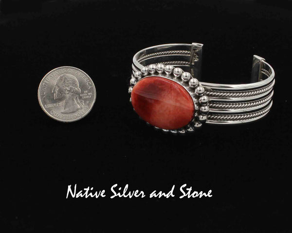 Z *Artie Yellowhorse - Navajo<br>3/4" Bracelet Cuff<br>3 Twist & Rail Band<br>29mm x 21mm Red/Orange Spiny Oval<br>Single Bead<br>Sterling Silver<br>Size 6-3/8 Medium (adjustable)