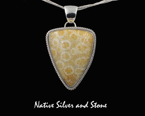 Z Artie Yellowhorse* - Navajo<br>Fossil Coral Pendant<br> Freeform Shield/Triangle<br>Lt Yellow Color<br>Double Twist Perimeter<br>Sterling Silver