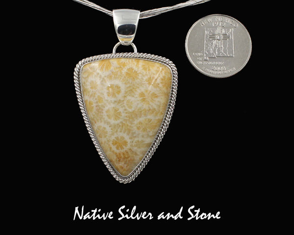 Z Artie Yellowhorse* - Navajo<br>Fossil Coral Pendant<br> Freeform Shield/Triangle<br>Lt Yellow Color<br>Double Twist Perimeter<br>Sterling Silver