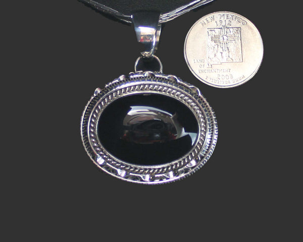 Z Artie Yellowhorse - Navajo<br>POTDSCP<br>1-3/8" Pendant<br>Black Onyx<br>Horizontal Oval (Medium) <br>Single Twist & Double Sawcut w Pinches<br>Sterling Silver