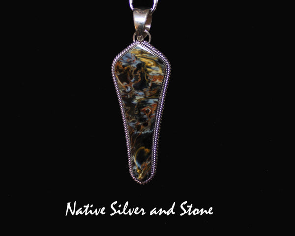 Z Artie Yellowhorse* - Navajo<br>2-3/4" Pendant<br>Natural Pietersite/Pietercite<br>Brown-Gold-Olive<br>Long Freeform "Shield"<br>Double Twist Perimeter<br>Sterling Silver