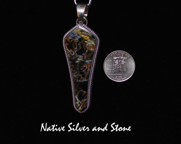 Z Artie Yellowhorse* - Navajo<br>2-3/4" Pendant<br>Natural Pietersite/Pietercite<br>Brown-Gold-Olive<br>Long Freeform "Shield"<br>Double Twist Perimeter<br>Sterling Silver