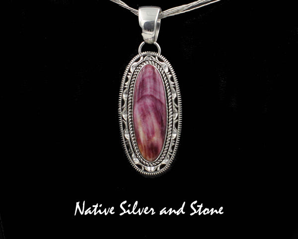 Z Artie Yellowhorse - Navajo<br>1-15/16" Pendant<br>Purple Spiny Oyster Vertical Oval<br>Single Twistwire &  Sawcut w Pinch<br>& Straight Cuts<br>Sterling Silver