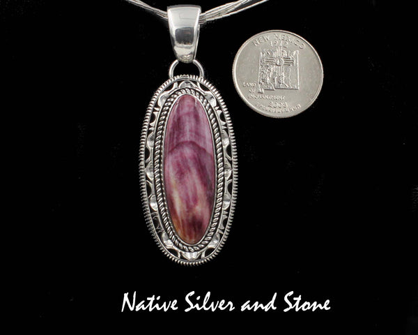 Z Artie Yellowhorse - Navajo<br>1-15/16" Pendant<br>Purple Spiny Oyster Vertical Oval<br>Single Twistwire &  Sawcut w Pinch<br>& Straight Cuts<br>Sterling Silver