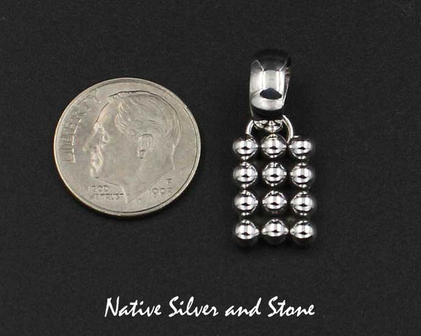 Z Artie Yellowhorse - Navajo<br>1/2" Pendant<br>Vertical Rectangle<br>12 Small Beads<br>4 Rows of 3<br>Sterling Silver