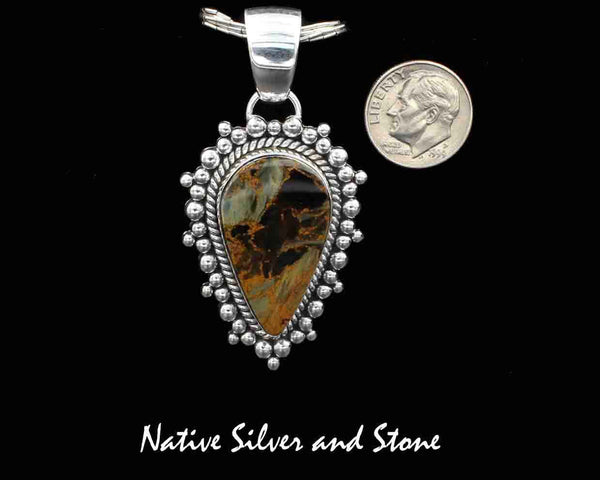 Z Artie Yellowhorse - Navajo<br>PPTBB<br>1-3/4"  Pendant<br>Single Twist & Burst Bead/Scatterdot<br>Small Medium Vertical<br>Reverse Teardrop<br>30mm x 17mm Pietersite/Pietercite<br>Brown-Gold-Olive Dominant<br>Sterling Silver