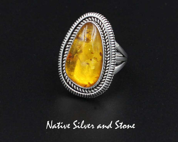 Z Artie Yellowhorse - Navajo<br>1-1/8" Ring - Soft Triangle<br>21mm x 12mm Amber<br>Twist Wire & Sawcut<br> Sterling Silver<br>Size 8