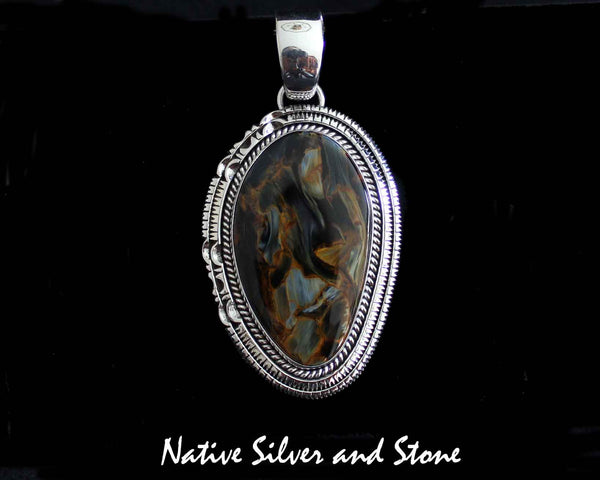 Z Artie Yellowhorse - Navajo<br>2-1/8" Pendant<br>Pietersite/Pietercite - Brown/Gold<br> Large Vertical Freeform<br>Single Twist & Double Sawcut<br>Sterling Silver
