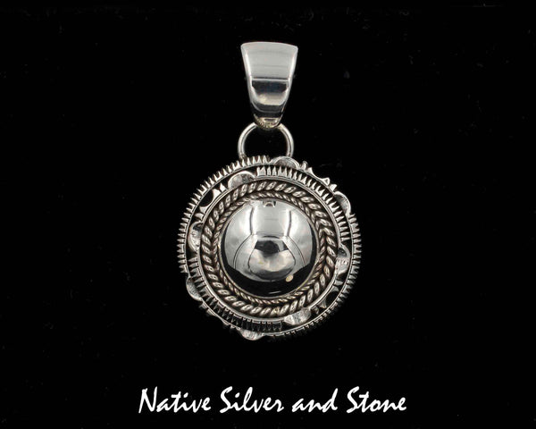 Z Artie Yellowhorse - Navajo<br>1-1/8" Pendant<br>Dome with Single Twist<br>and Double Sawcut with Pinch<br>Sterling Silver