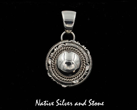 Z Artie Yellowhorse - Navajo<br>1-1/8" Pendant<br>Dome with Single Twist<br>and Double Sawcut with Pinch<br>Sterling Silver