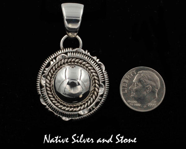 Z Artie Yellowhorse - Navajo<br>1-1/8" Pendant<br>Dome with Single Twist<br>and Double Sawcut with Pinch<br>Sterling Silver