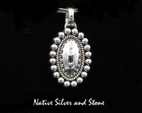 Z Artie Yellowhorse - Navajo<br>1-1/8" Pendant<br>Domed Oval<br>Single Twist & Bead<br>Sterling Silver