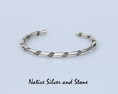 Z Elaine Tahe - Navajo<br>3/16" Bracelet Cuff<br>Round Stock with Double Twist<br>Sterling Silver<br>Size: 7-1/16" Large