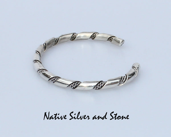 Z Elaine Tahe - Navajo<br>3/16" Bracelet Cuff<br>Round Stock with Double Twist<br>Sterling Silver<br>Size: 7-1/16" Large
