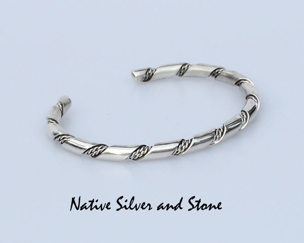 Z Elaine Tahe - Navajo<br>3/16" Bracelet Cuff<br>Round Stock with Double Twist<br>Sterling Silver<br>Size: 7-1/16" Large