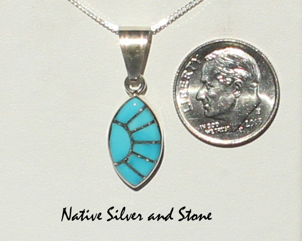 Z Eldrick & Charlotte Seoutewa<br> Zuni Jewelry<br>Pendant (Only)<br>Turquoise<br>Sharp Oval Multi-Inlays<br>Silver Sun Ray Accent