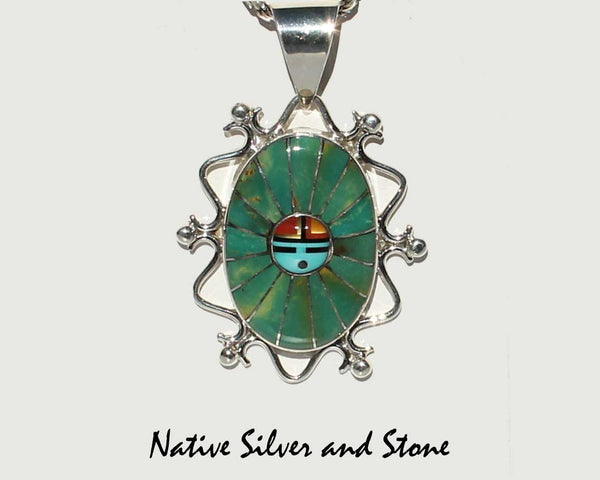 Eldrick & Charlotte Seoutewa<br> Zuni Jewelry<br>Pendant (Only)<br>Oval Multi-Inlays<br>Green Kingman Turquoise, Jet, Coral<br>Mother of Pearl, Blue Turquoise<br>Silver Filagree & Dot Accents