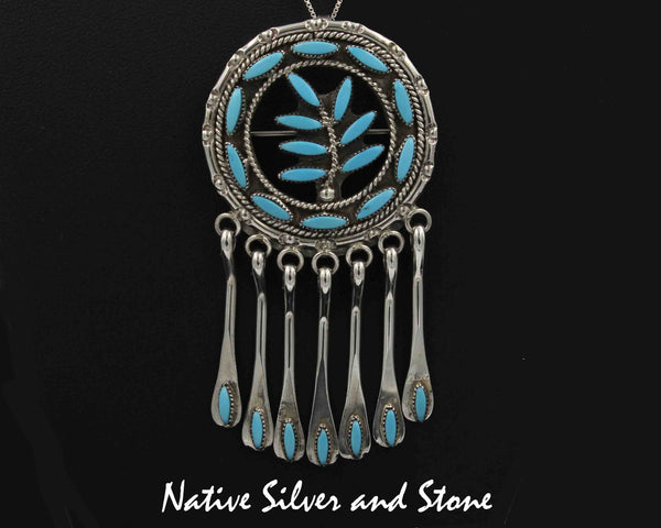 Floyd Etsate - Zuni<br>Pendant and Pin<br>Turquoise Needlepoint<br>Circle with Branch and Dangle Paddles<br>in Sterling Silver