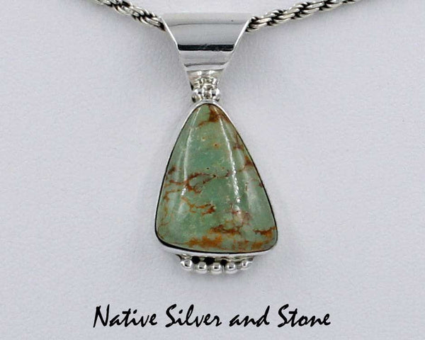 Z Gene & Martha Jackson<br>Both Deceased<br>Navajo<br>1-7/16" Pendant (Only)<br>Natural Green Turquoise Triangle<br>Silver Beaded Bottom